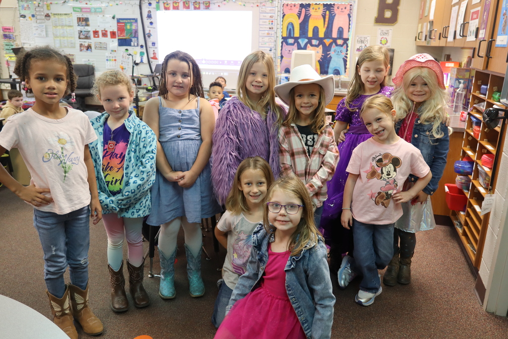 group of kids dressed up for dolly parton day
