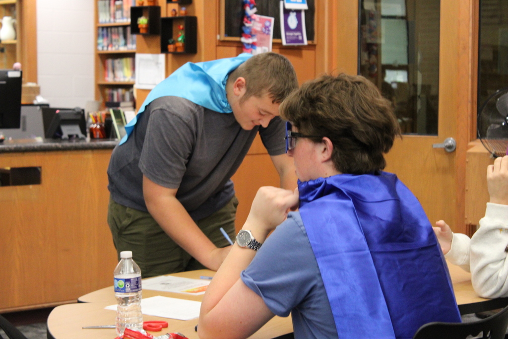 student signing up at a table