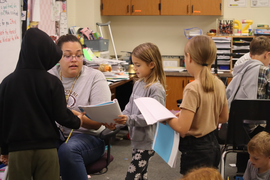 students talking to teachers 