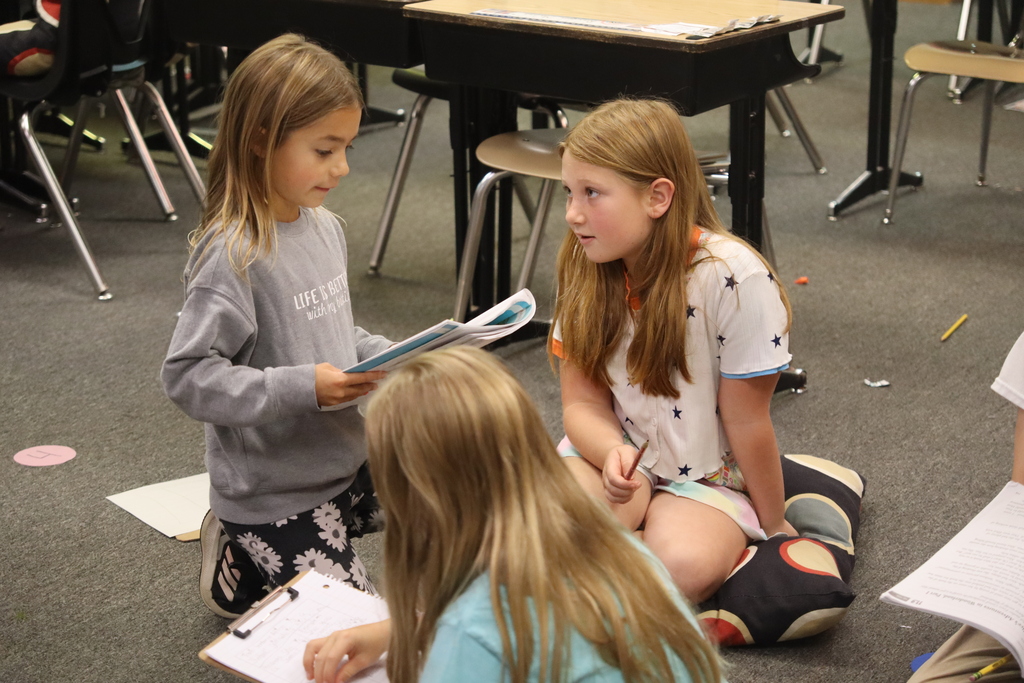 students reading to each other