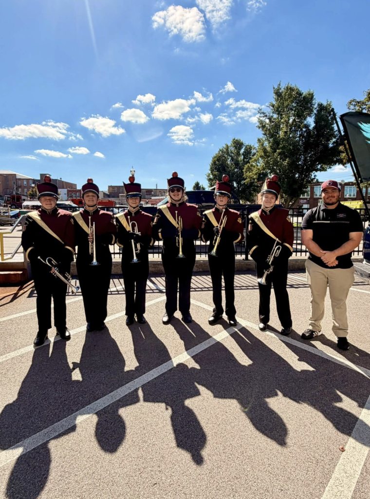 band members with teacher assistant