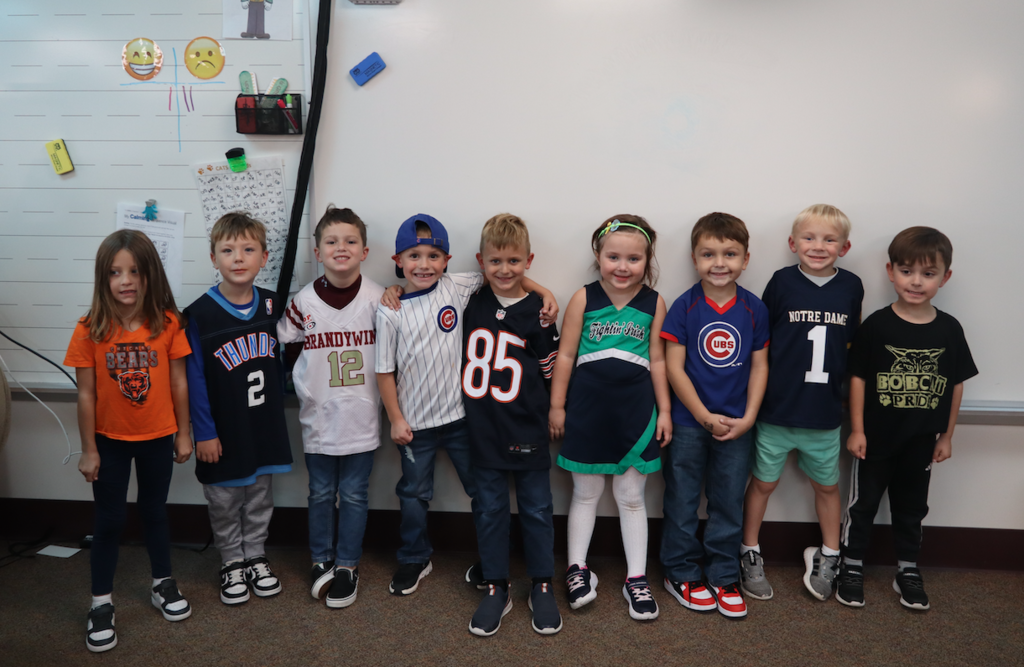 group of kindergarteners in team outfits