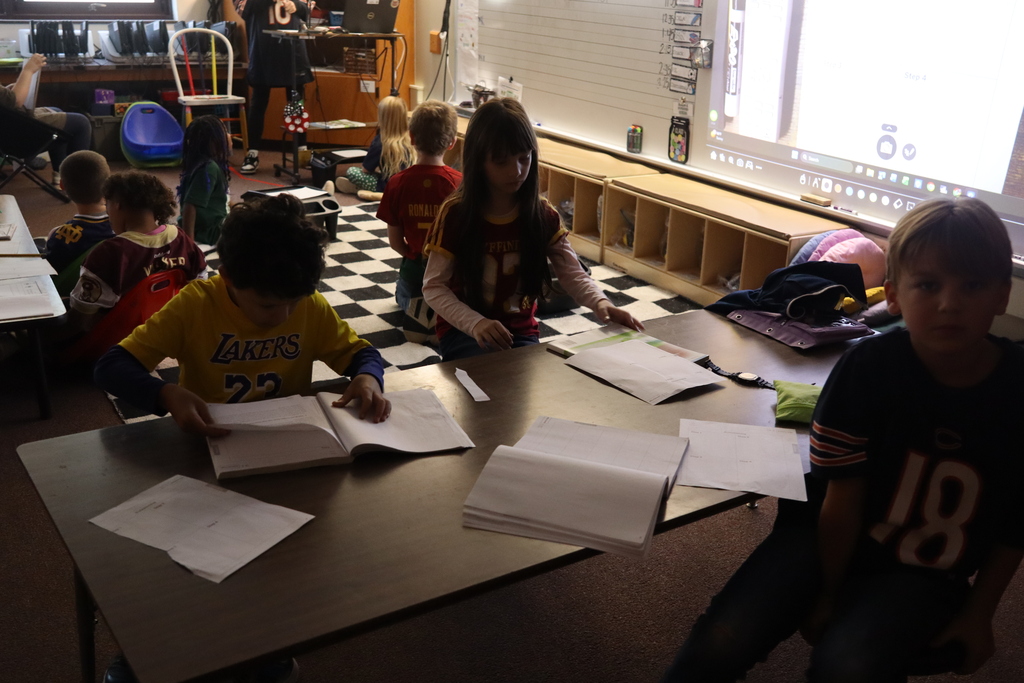 students working at their work table