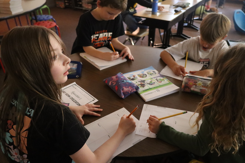 students sitting at a desk