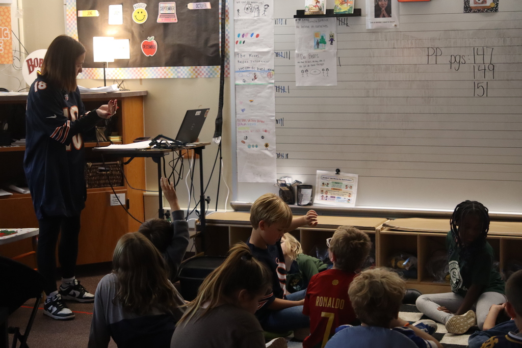 students listening to teacher