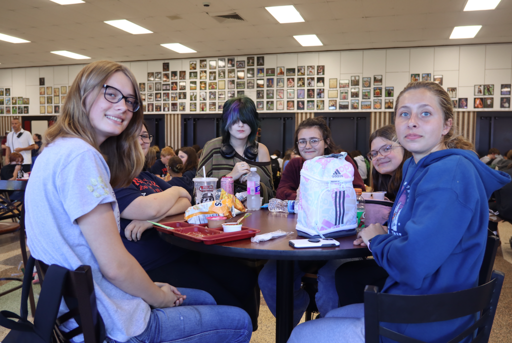 students sitting at table at lunch