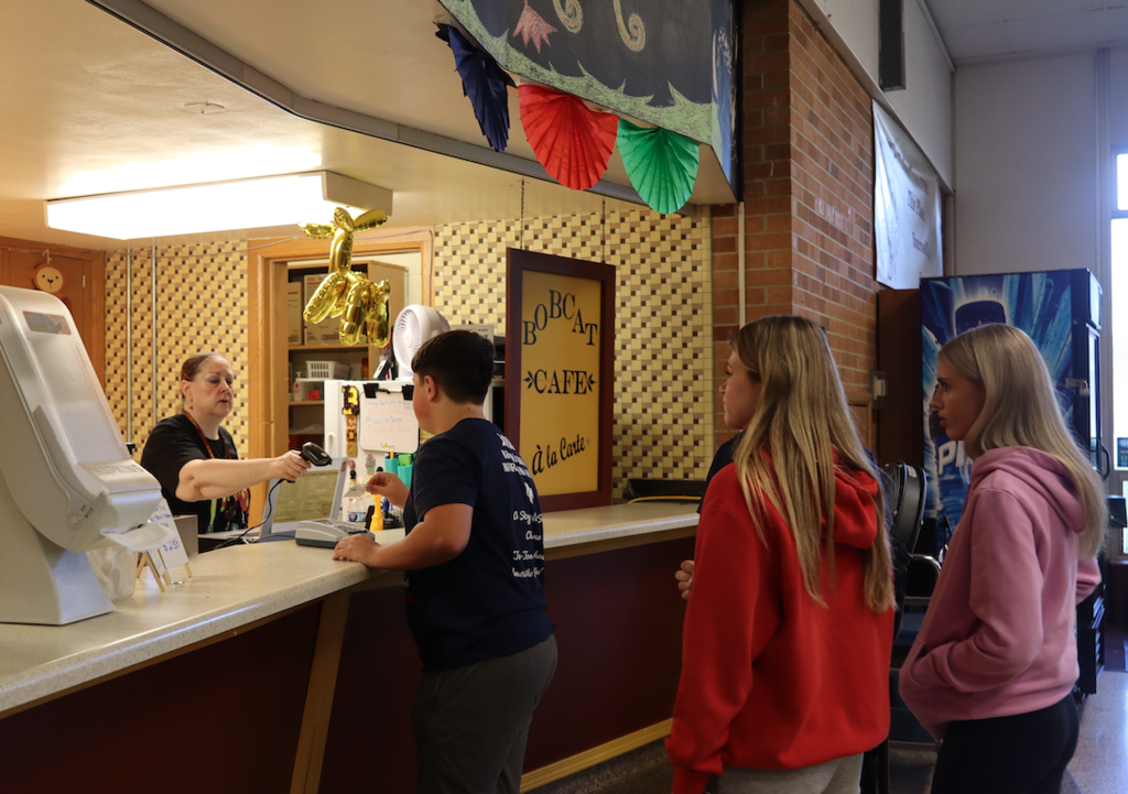 kids standing in line at cafe