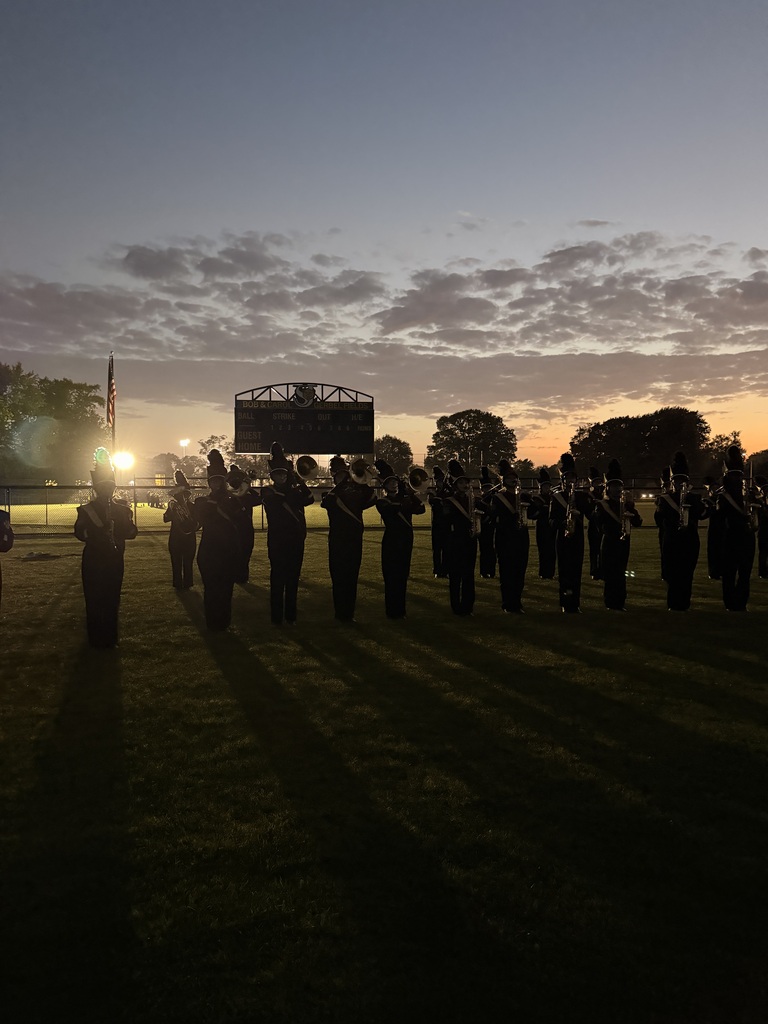 band performing on field in the dark