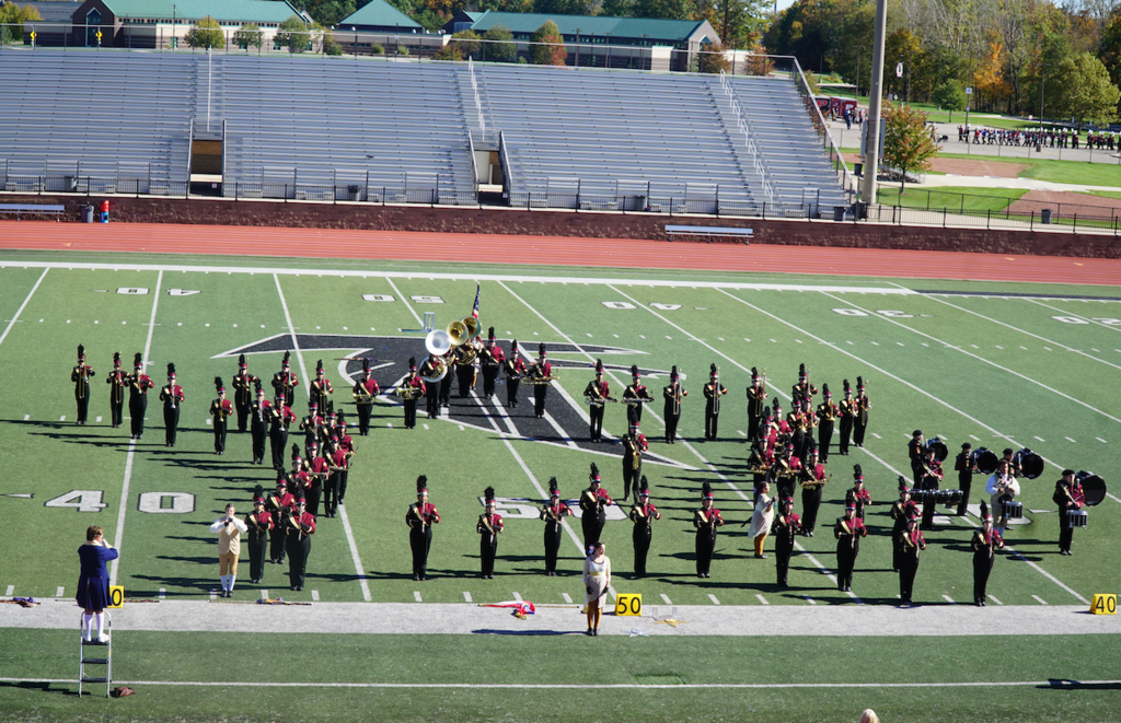 band forming star on football field