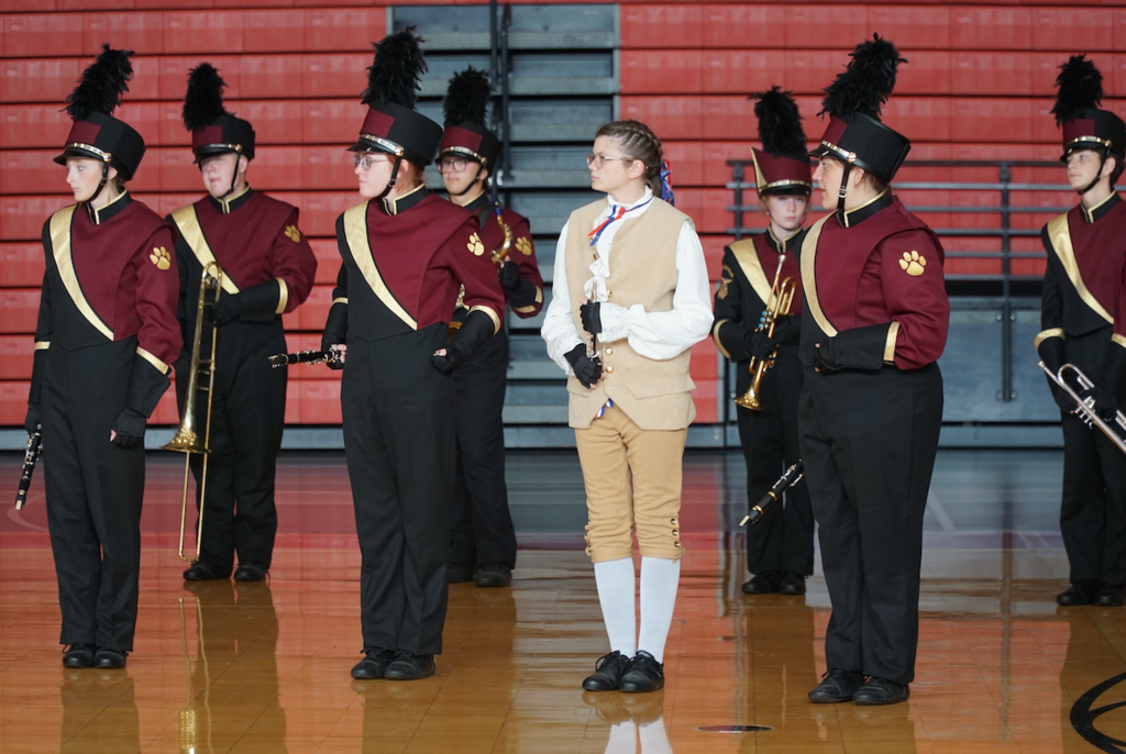 band standing in gym 