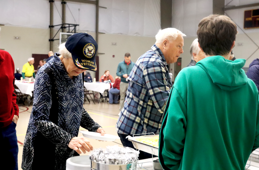 veterans standing in line for breakfast
