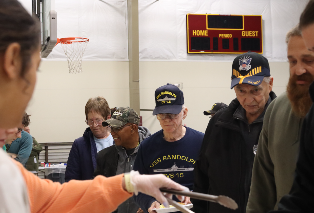 veterans standing in line for breakfast