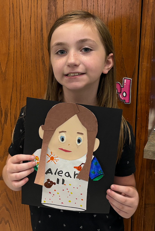 young girl with self portrait art project