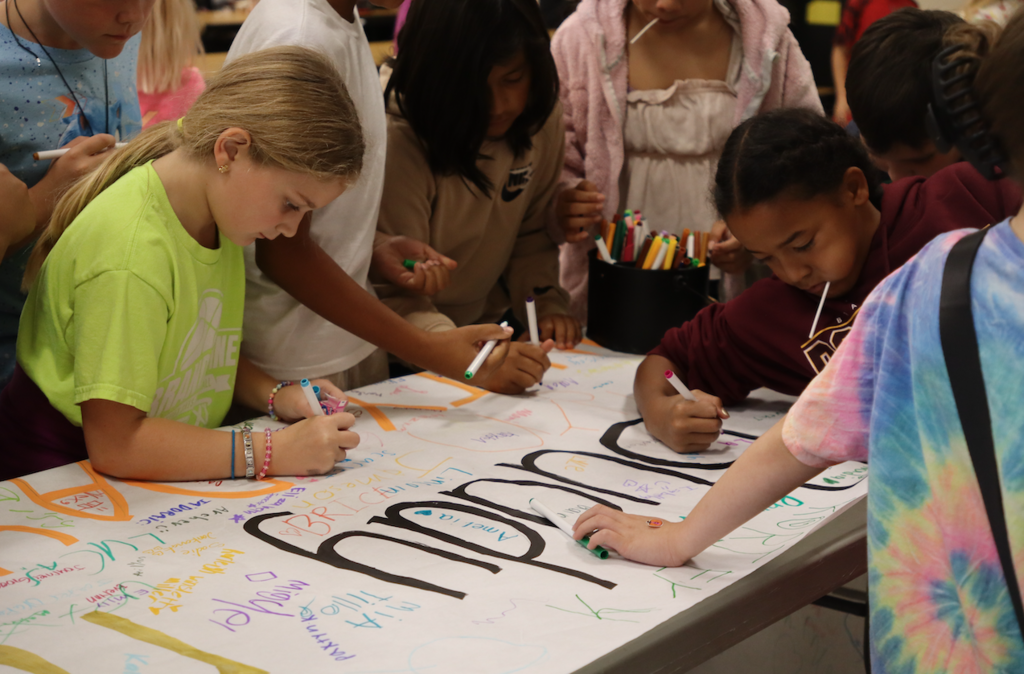 elementary kids signing banner