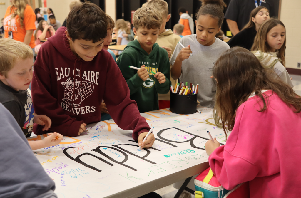 elementary kids signing banner