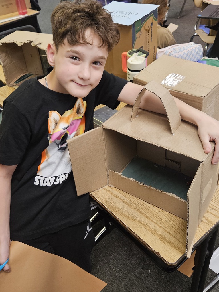 little boy working on a project