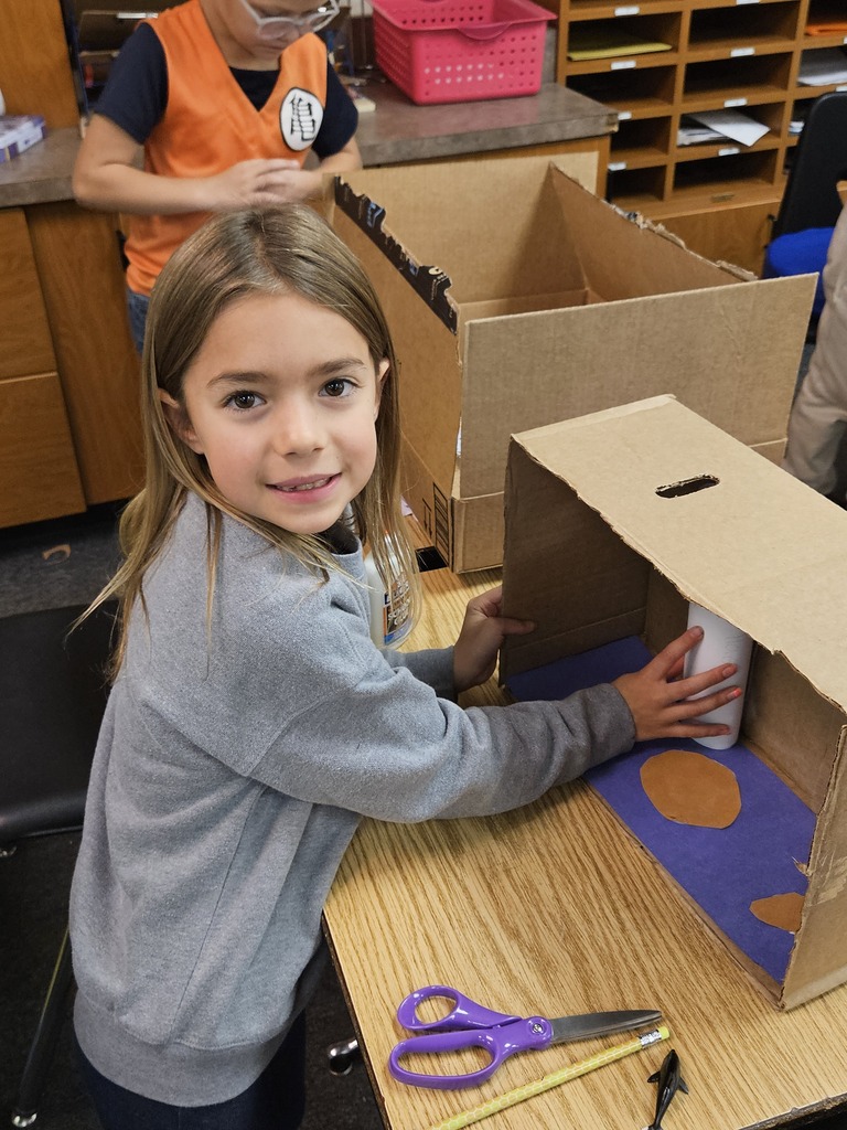 little girl working on a project