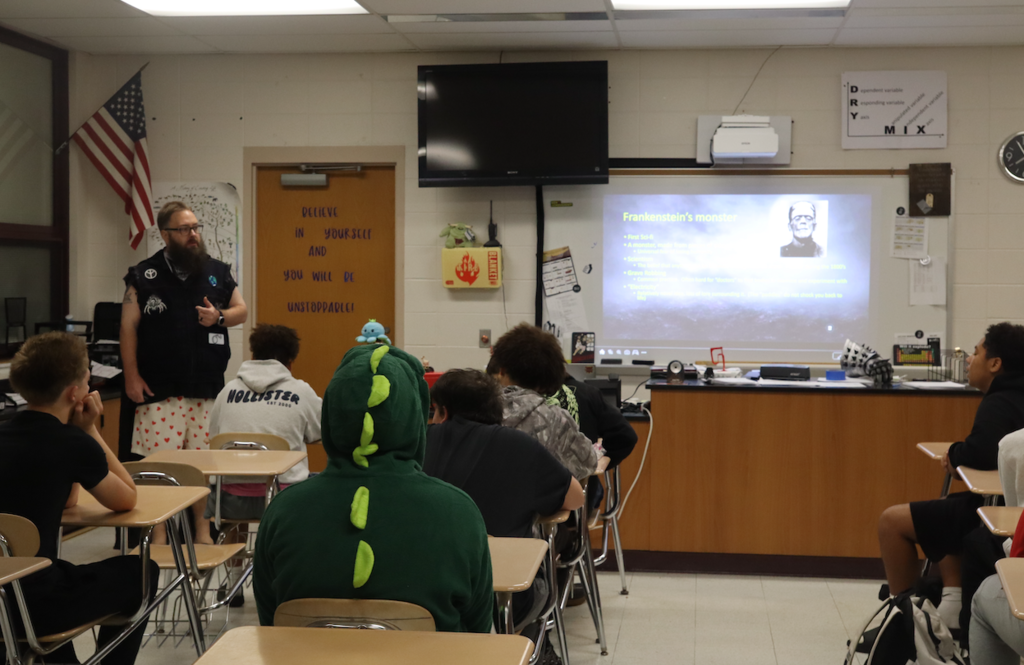 teacher presenting to class on Frankenstein's monster