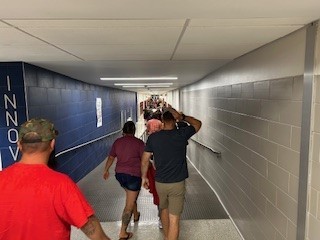 parents and students walking down the hallway