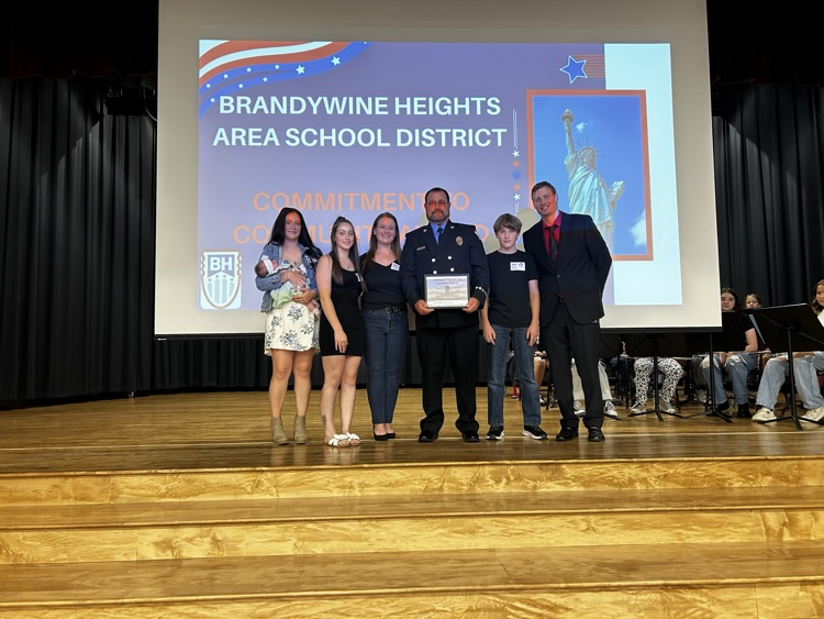 award recipient stands with family