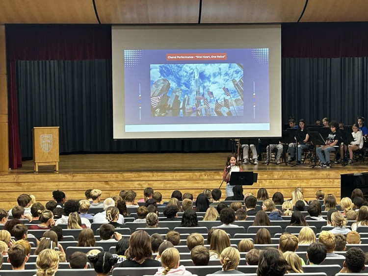 student speaks in front of student body