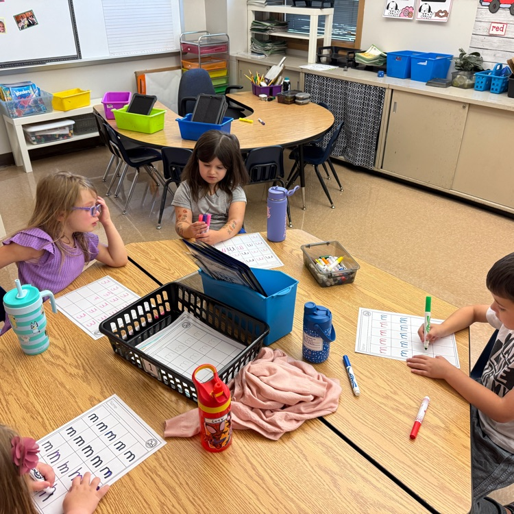 practicing letter m