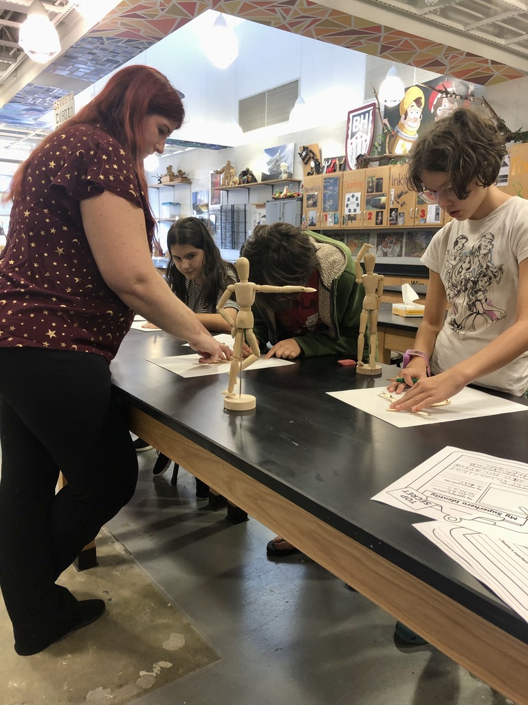 Students design their own superheroes.