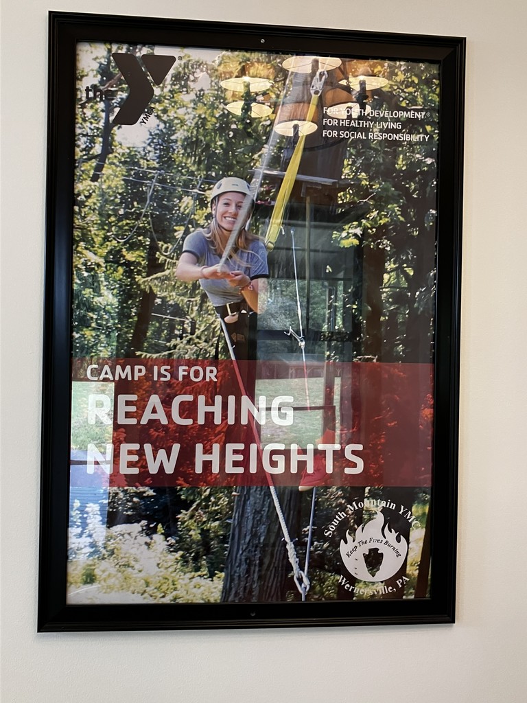 picture of camp photo stating "camp is for reaching new heights"