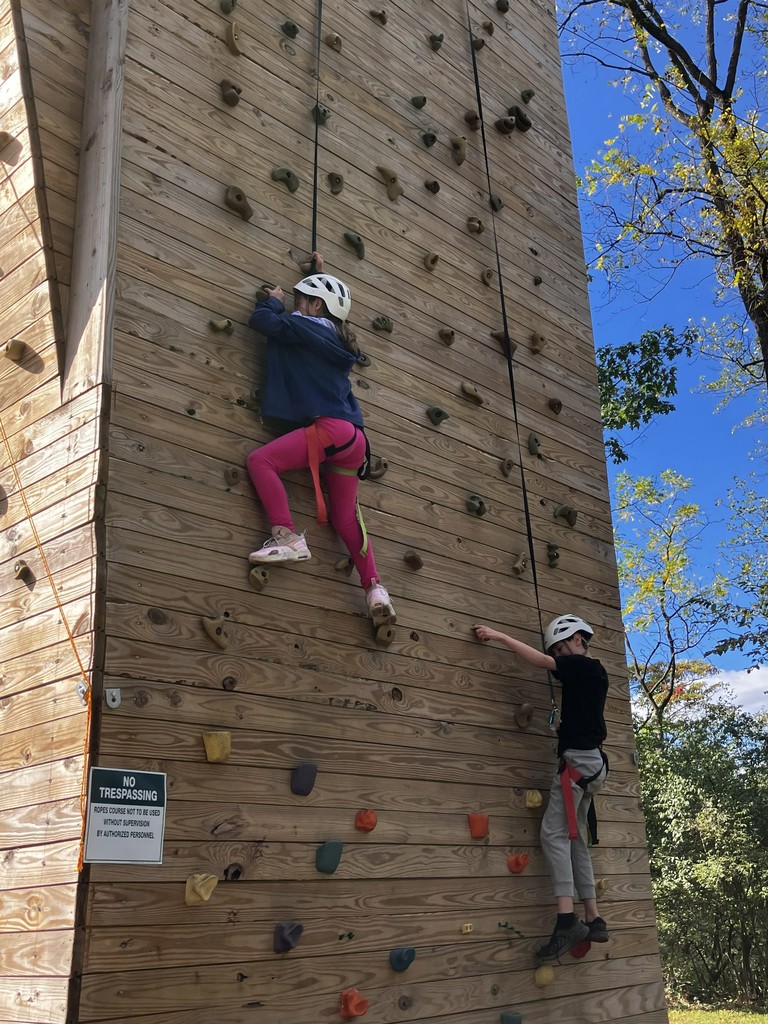 two students on the climbing wall