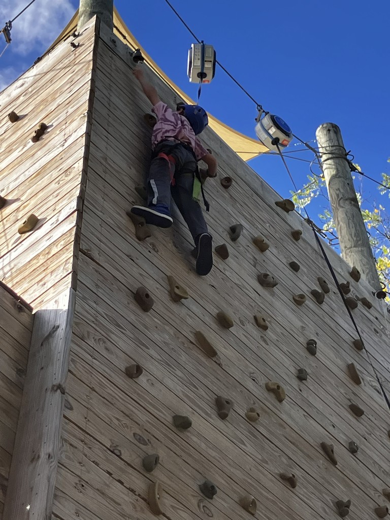student on the climbing wall