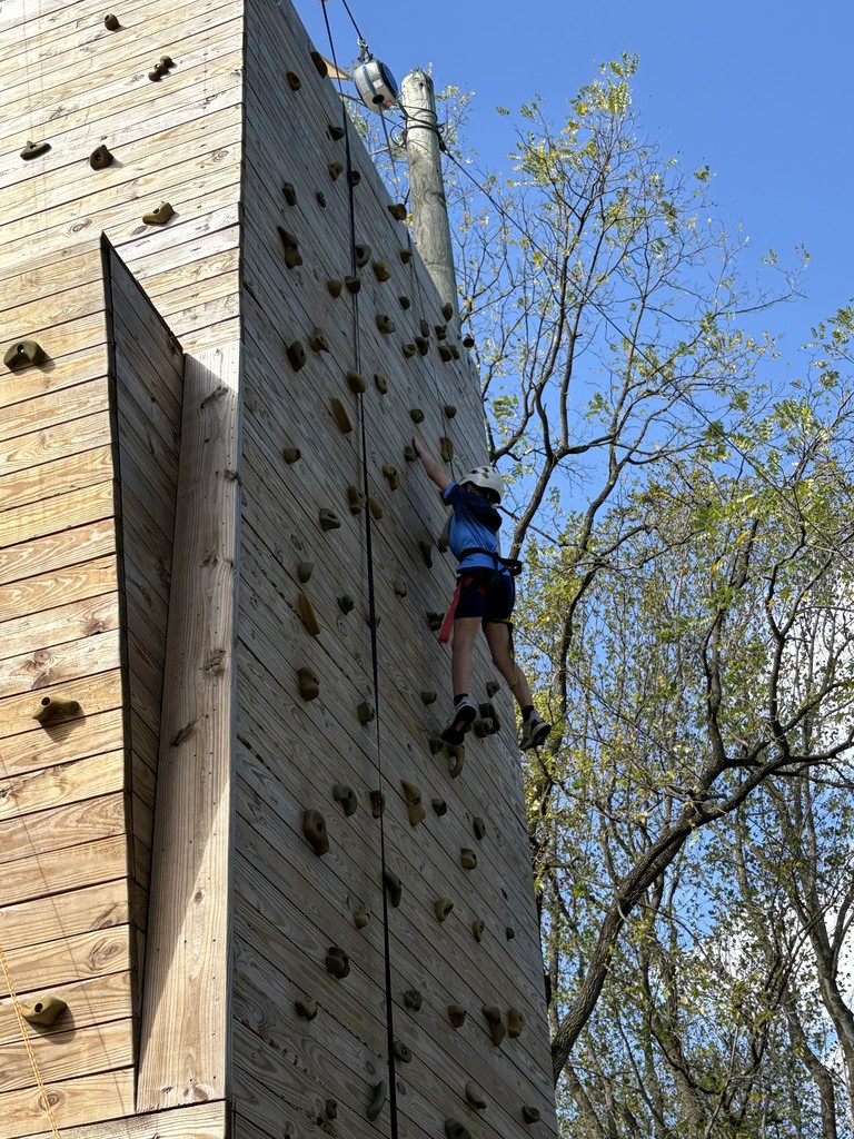 student on the climbing wall