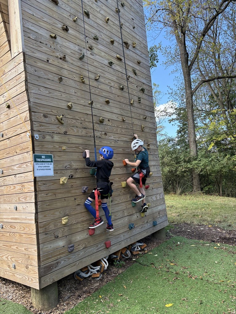 two students on the climbing wall