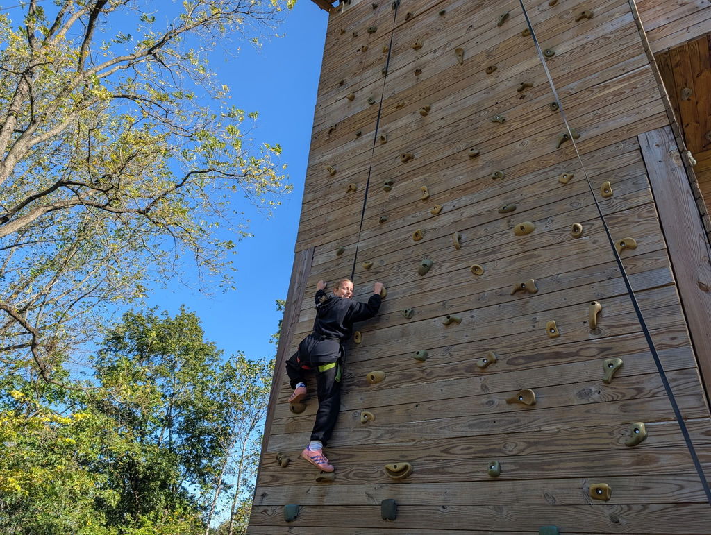student on the climbing wall