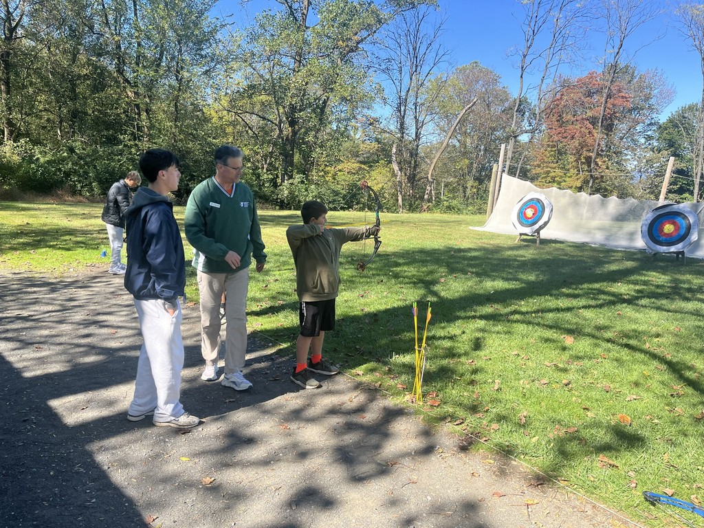 student shooting  archery