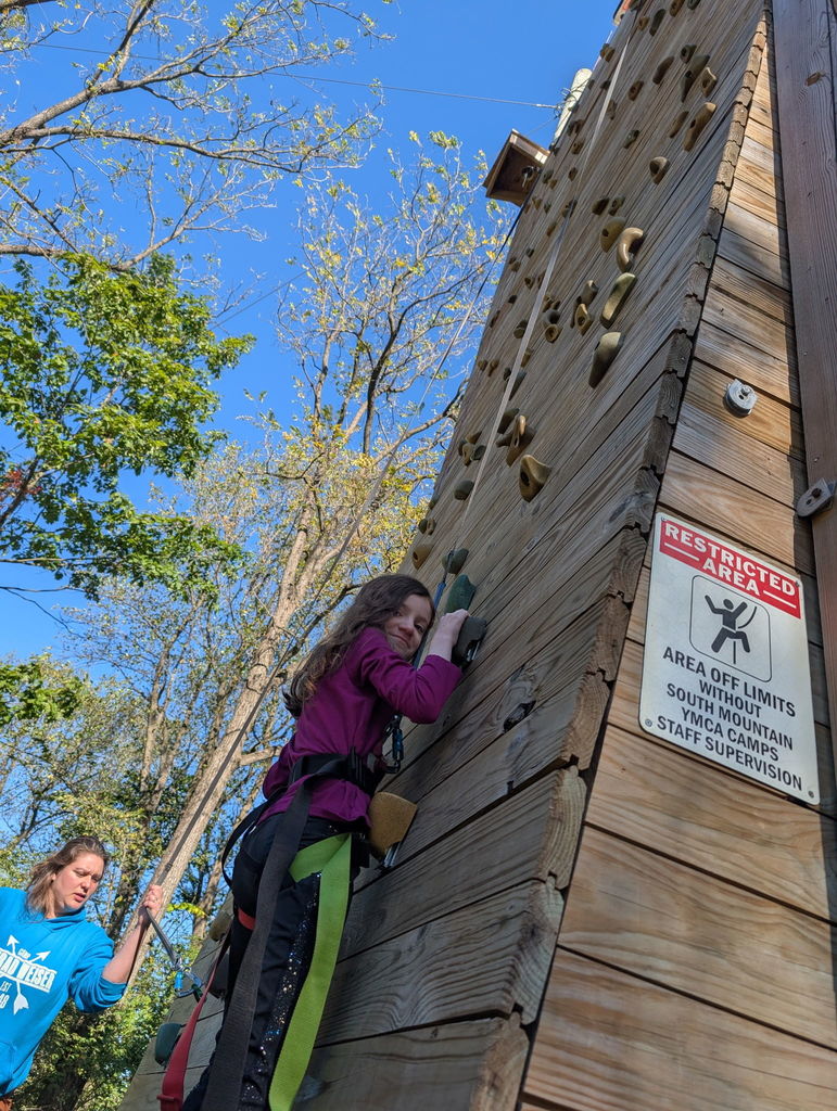 student on the climbing wall