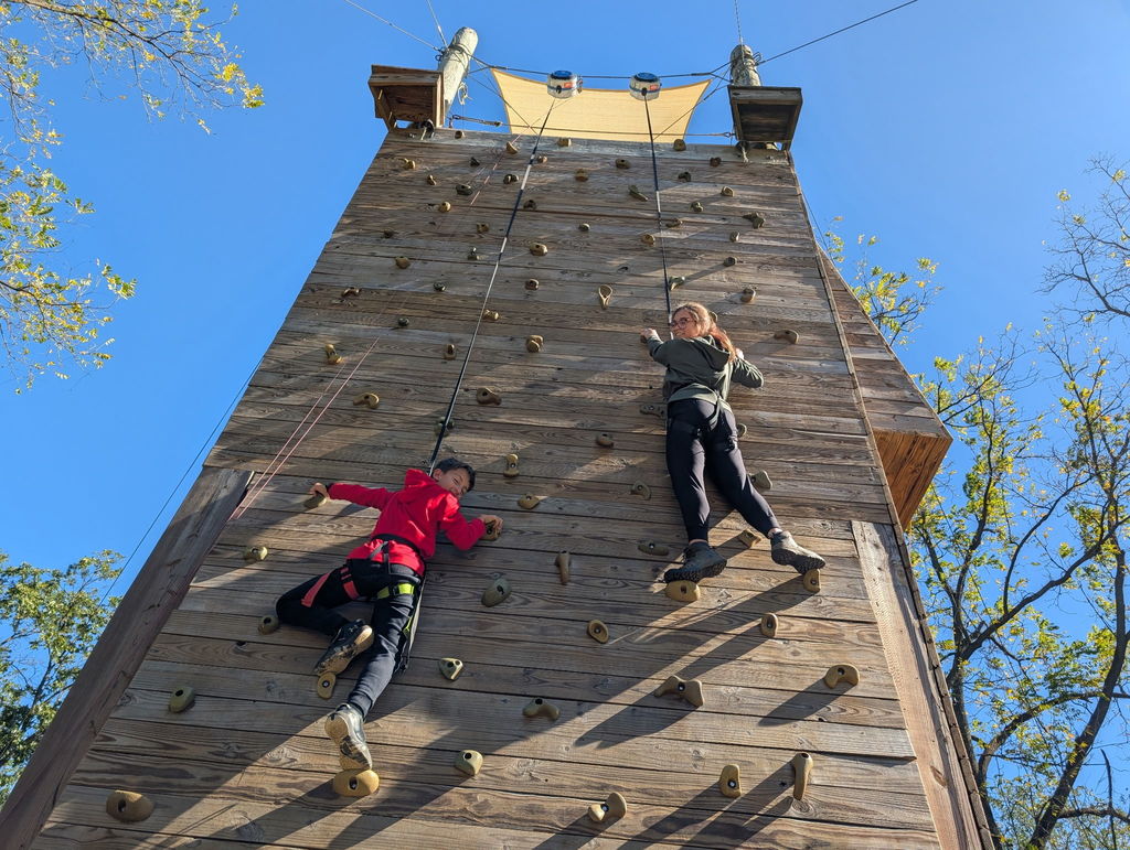 students on the climbing wall