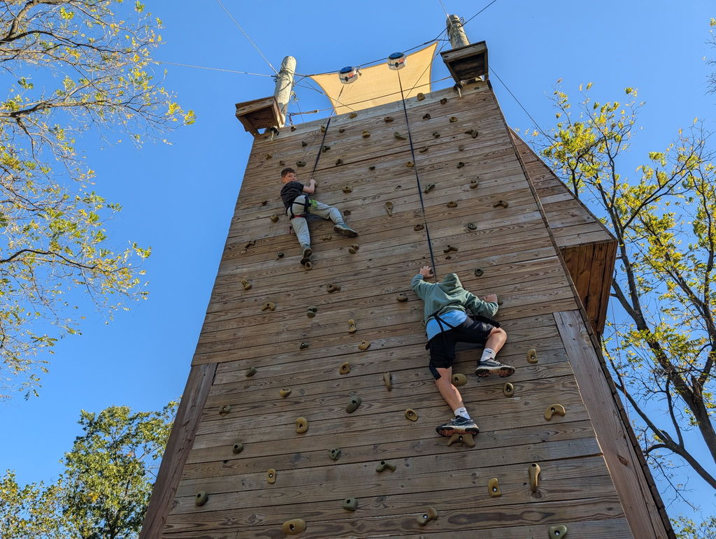 students on the climbing wall