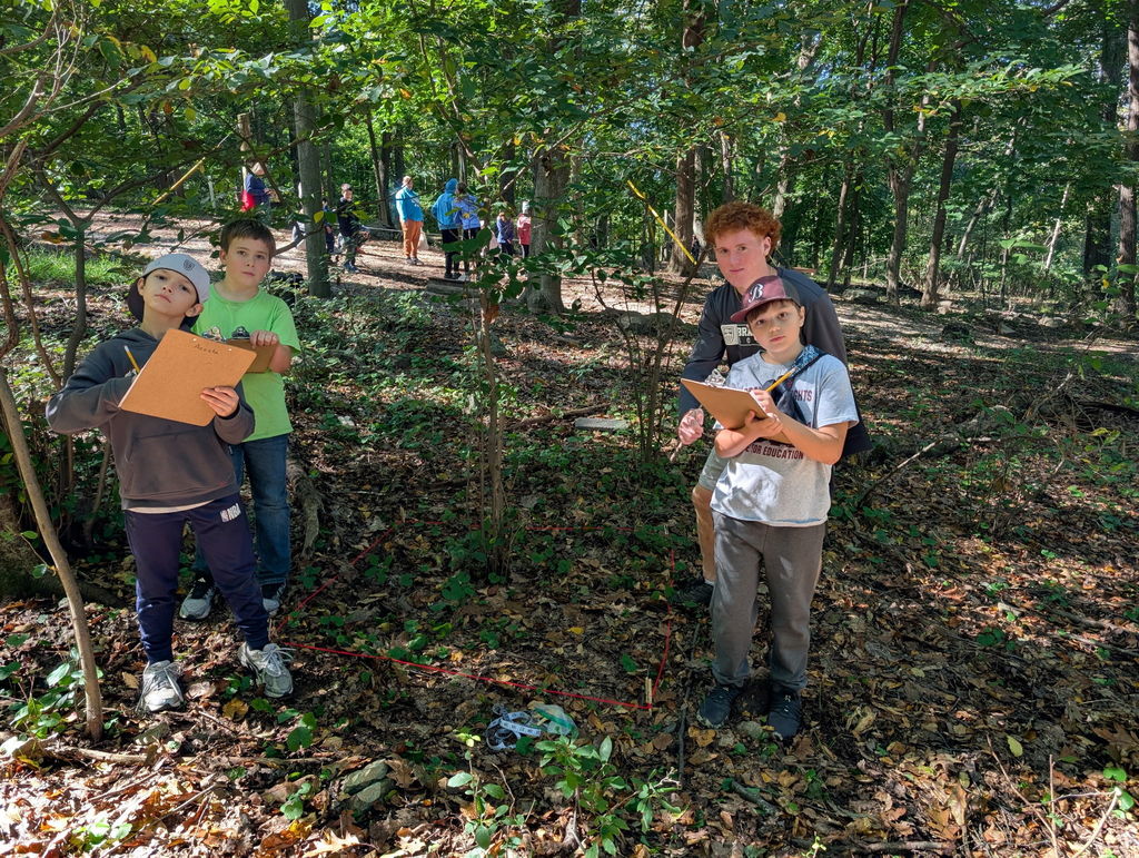 students with clipboards