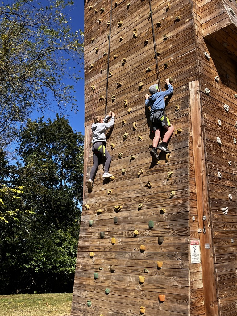 students on climbing wall