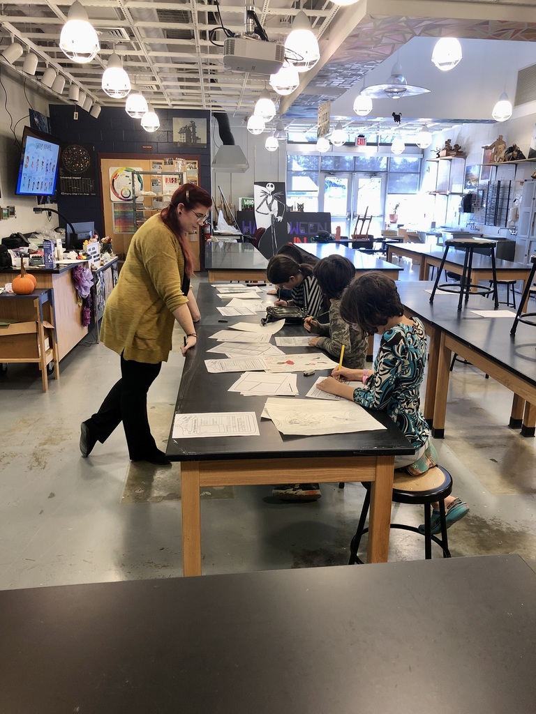 Students practice creating their own comic panels.