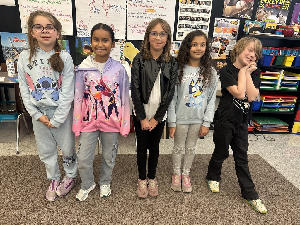 five students stand together