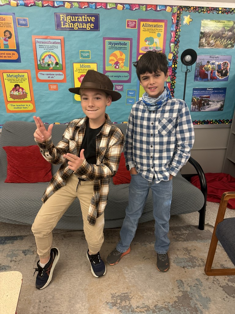 two cowboys stand together