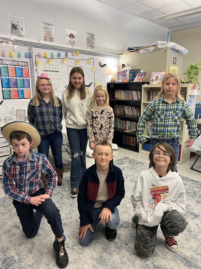 7 students together wearing western clothes