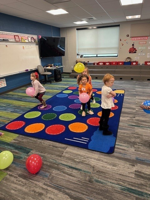 students with balloons