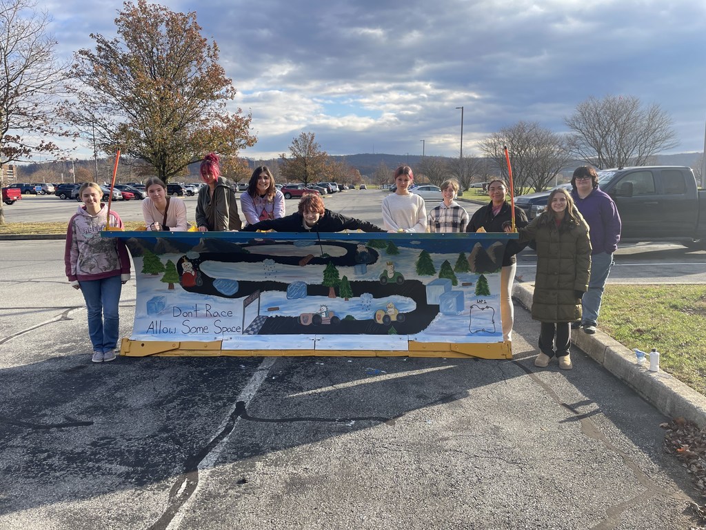 Art club students and finished plow
