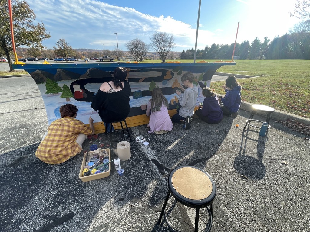 Students working on plow
