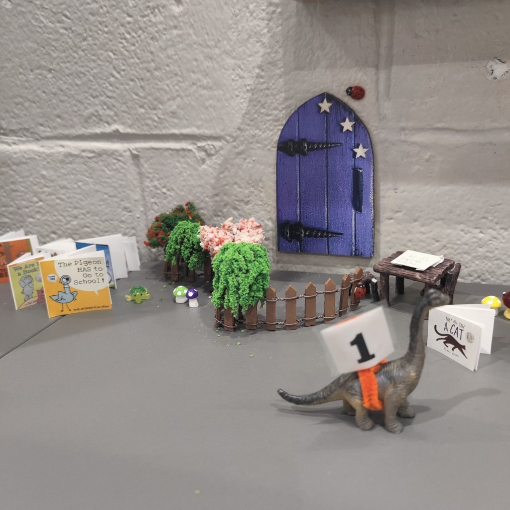 Dino visiting the library fairy