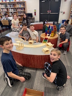 students building with wooden pieces