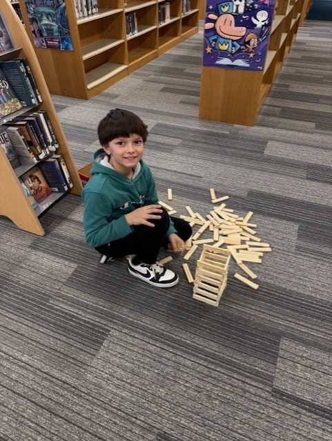 student building tower with wooden pieces