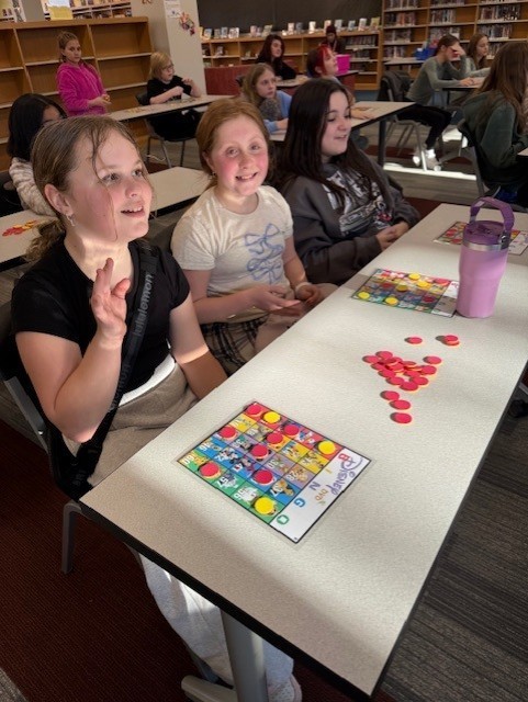 students sitting playing bingo